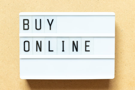 Lightbox with word buy online on wood backgroundの写真素材
