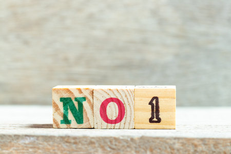 Alphabet letter block in word no 1 on wood backgroundの写真素材