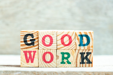 Alphabet letter block in word good work on wood background
