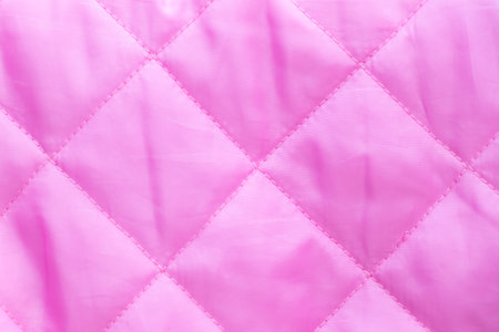 Pink color of cloth with diamond shape texture background