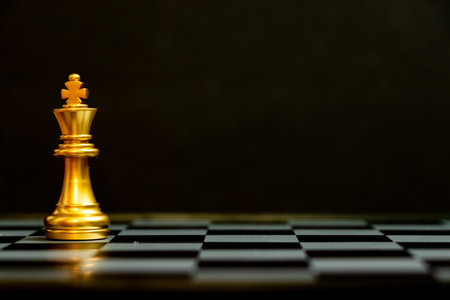 Gold king chess piece stand on black background with copy space (Concept for leadership, unique)
