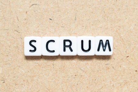 White tile alphabet letter with word scrum on wood backgroundの写真素材