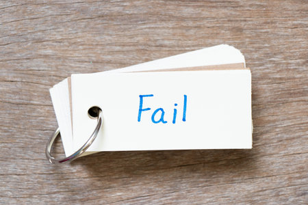 Flash card with handwriting in word fail on wood backgroundの写真素材