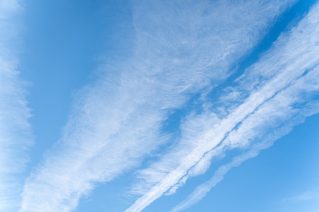 Clear blue sky with white cloud background