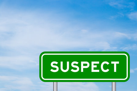 Green color sign with word suspect on blue sky with white cloud backgroundの写真素材