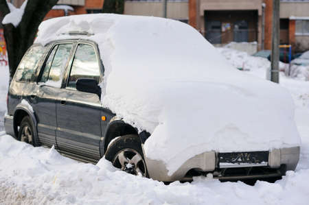 This is dead car, black metal in winterの写真素材