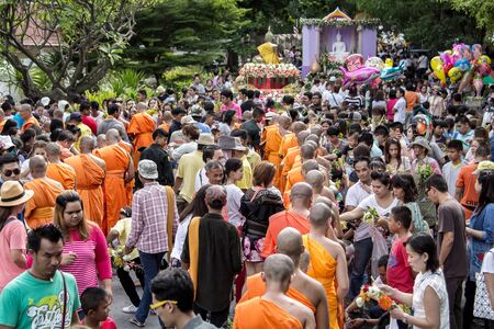 SARABURI, THAILAND - JULY 11: The unidentified people put flowers into a monk\\\\\\\\