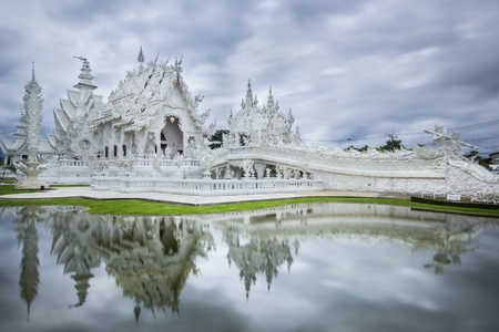Magnificently grand white church and reflection in the water, Rong Khun temple, Chiang Rai province, northern Thailandの写真素材
