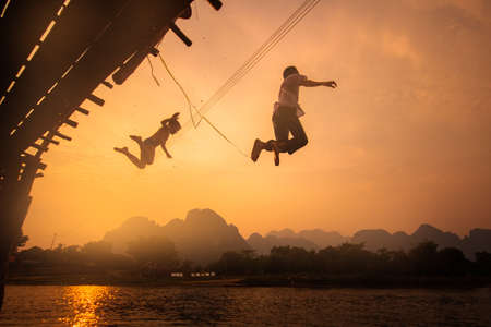VANG VIENG, LAOS - MARCH 17, 2014: Vang Vieng is a tourism-oriented town in Laos, located in Vientiane Province about four hours bus ride north of the capital.のeditorial素材