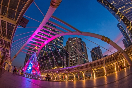 BANGKOK - DEC 19 :Buildings and a sky walk architecture like a spider for transit between Sky Transit and Bus Rapid Transit Systems Sathorn-Narathiwas junction on December 19, 2014 in Bangkok, Thailand.のeditorial素材