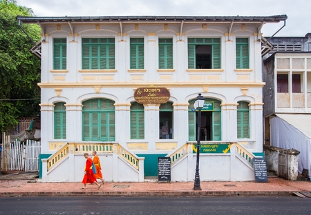 LUANG PRABANG LAOS  JUNE 9 2015 : Young buddhist monks at city street. Luang Prabang Laos travel landscape and destinationsのeditorial素材