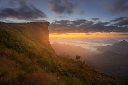 Sunrise scene with the peak of mountain and cloudscape at Phu chi fa in Chiangrai,Thailandの写真素材