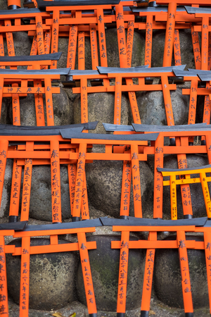 KYOTO, JAPAN - MARCH 24, 2016 : Ema prayer tables with unique Torii gates boards at Fushimi Inari Taisha Temple in Kyoto. Pray for luck, wealth, happiness, health, fortune, protection.のeditorial素材