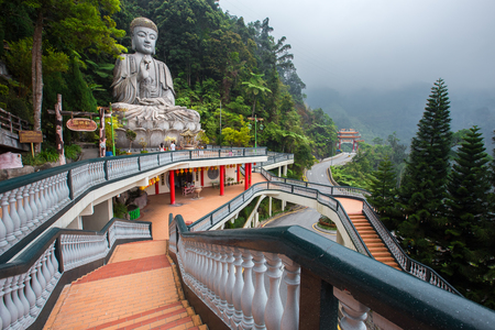 Genting Highlands, Malaysia - AUGUST 19, 2016: Large stone Buddha statue at Chin Swee Caves Temple in Genting Highlands, Pahang, Malaysiaのeditorial素材