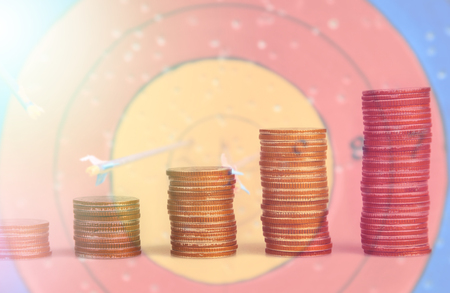 Double exposure condo of coins with archer background, Finance and banking conceptの写真素材