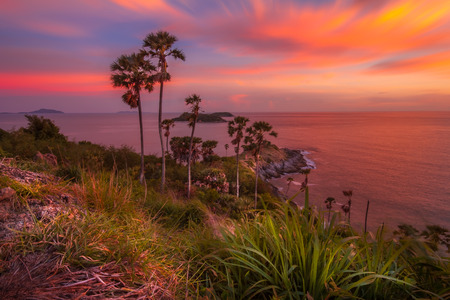 Promthep Cape is a mountain of rock that extends into the sea view point sunset in Phuket, Thailandの写真素材