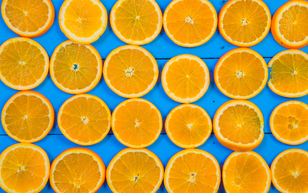 Abstract background with citrus-fruit of orange slices. Close-up. Studio photography.