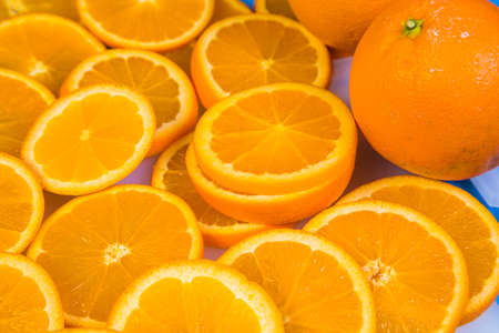 Fresh ripe oranges on wooden table. Top view with copy spaceの写真素材