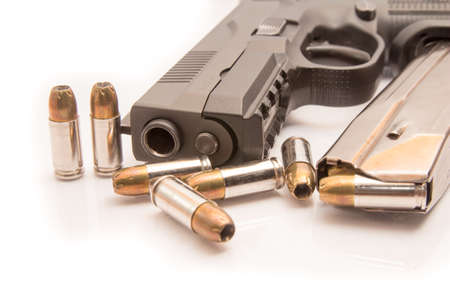 close-up on 9mm ammo with a handgun.の写真素材