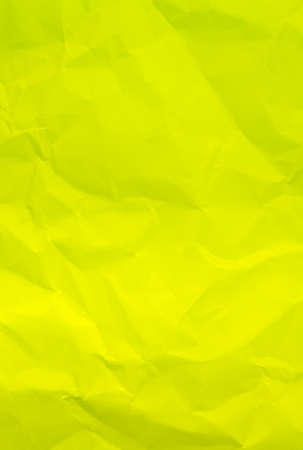 Crumpled yellow paper backgroundの写真素材