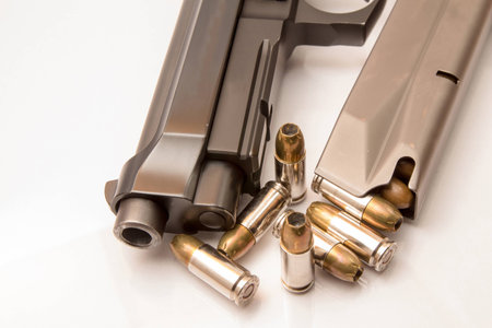 close-up on 9mm ammo with a handgun.