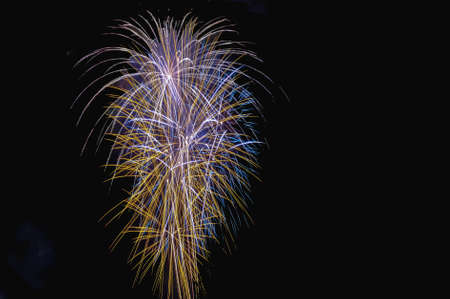 Abstract colored firework background with free space for textの写真素材