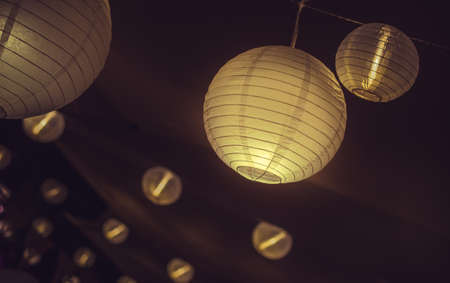 Shining lampions on a ceilingの写真素材