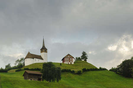 Small village on the hill in Switzerlandの写真素材