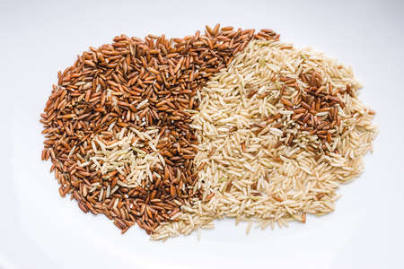 Flat lay shot of a red and white rice shaped as a yin yang symbolの写真素材