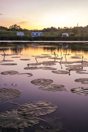 Sunset over the peaceful lakeの写真素材