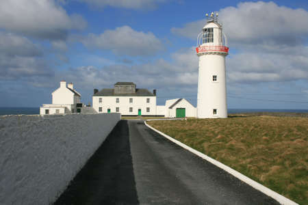 Old historic lighthouse in the west of Ireland の写真素材