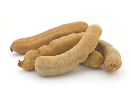 Heap of Tamarind Fruits isolated on whiteの写真素材
