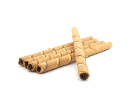 Wafer roll sticks cream rolls over a white background の写真素材