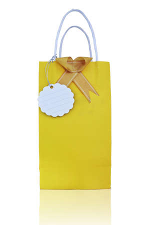 Yellow paper bag with gift card on whiteの写真素材