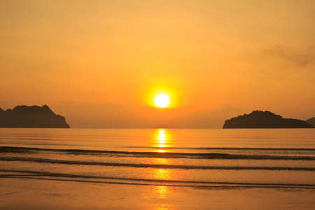 morning on the beach with sunrise  の写真素材
