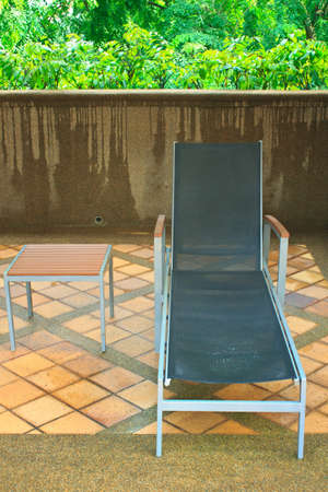 lounger next to a swimming pool  の写真素材