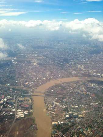 city under high blue sky with white clouds