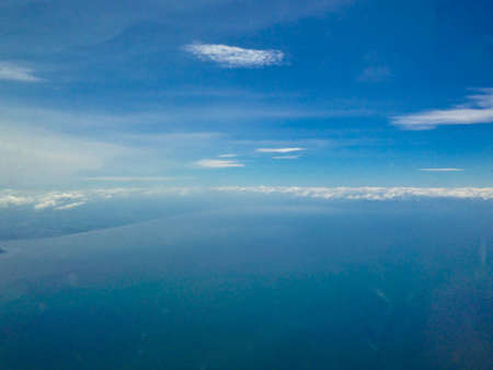 Blue sky sea of clouds from high altitudeの写真素材