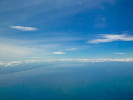 Blue sky sea of clouds from high altitudeの写真素材