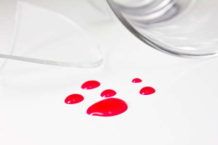 Broken glass with red water like blood  の写真素材
