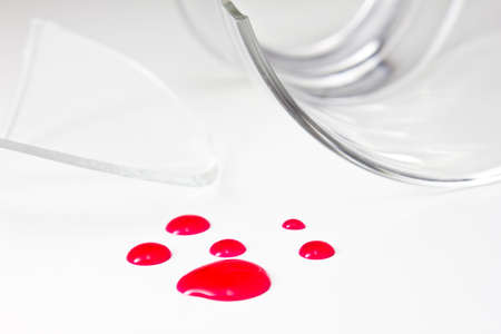 Broken glass with red water like blood  の写真素材