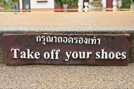 " take off your shoes " sign and Thai languageの写真素材