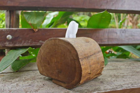 Tissue paper box made from log on old wooden table の写真素材