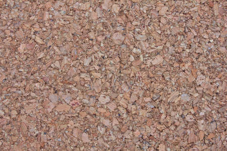 brown background surface of compressed brown wood splinters and sawdust の写真素材