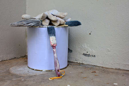 set of painter tool front of old white wallの写真素材