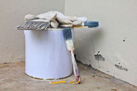 set of painter tool front of old white wallの写真素材