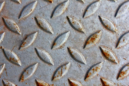 grunge and dirty iron floor plate with diamond motives  の写真素材
