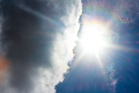 Beautiful blue sky with clouds and sun.の写真素材