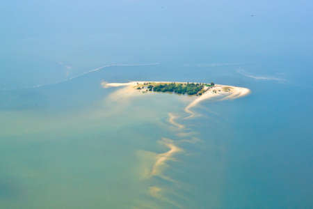 tropical island in the middle of ocean, top view, summer background の写真素材