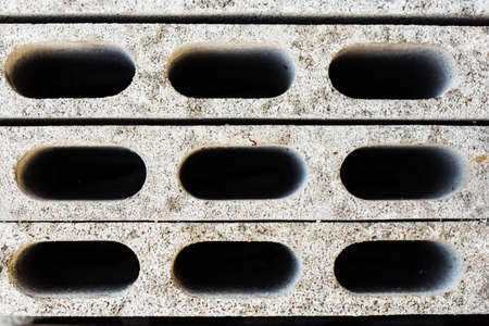 gray concrete construction blocks  a k a  breeze block, cement block, foundation block, besser block; professional term  Concrete Masonary Unit - CMU の写真素材